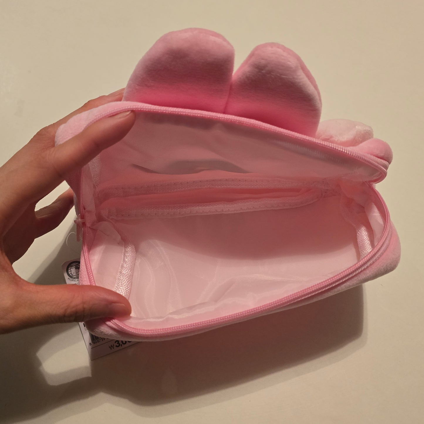 Daiso Korea Sanrio My Melody pouch interior view with spacious pink lining, ideal for organizing cosmetics in Sanrio pouch bag
