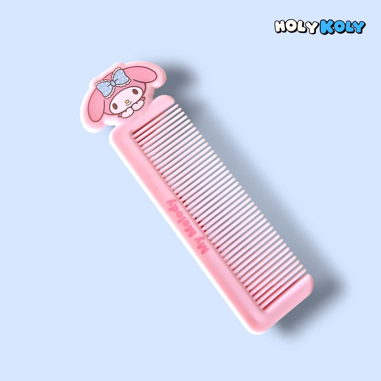 daiso korea sanrio My Melody pink hair comb angled view with engraved branding and character topper