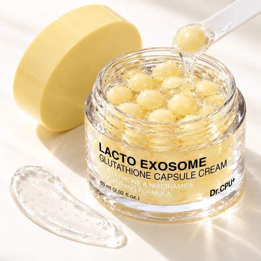 Yellow capsules dissolving into clear gel, Korean brightening capsule cream texture close-up