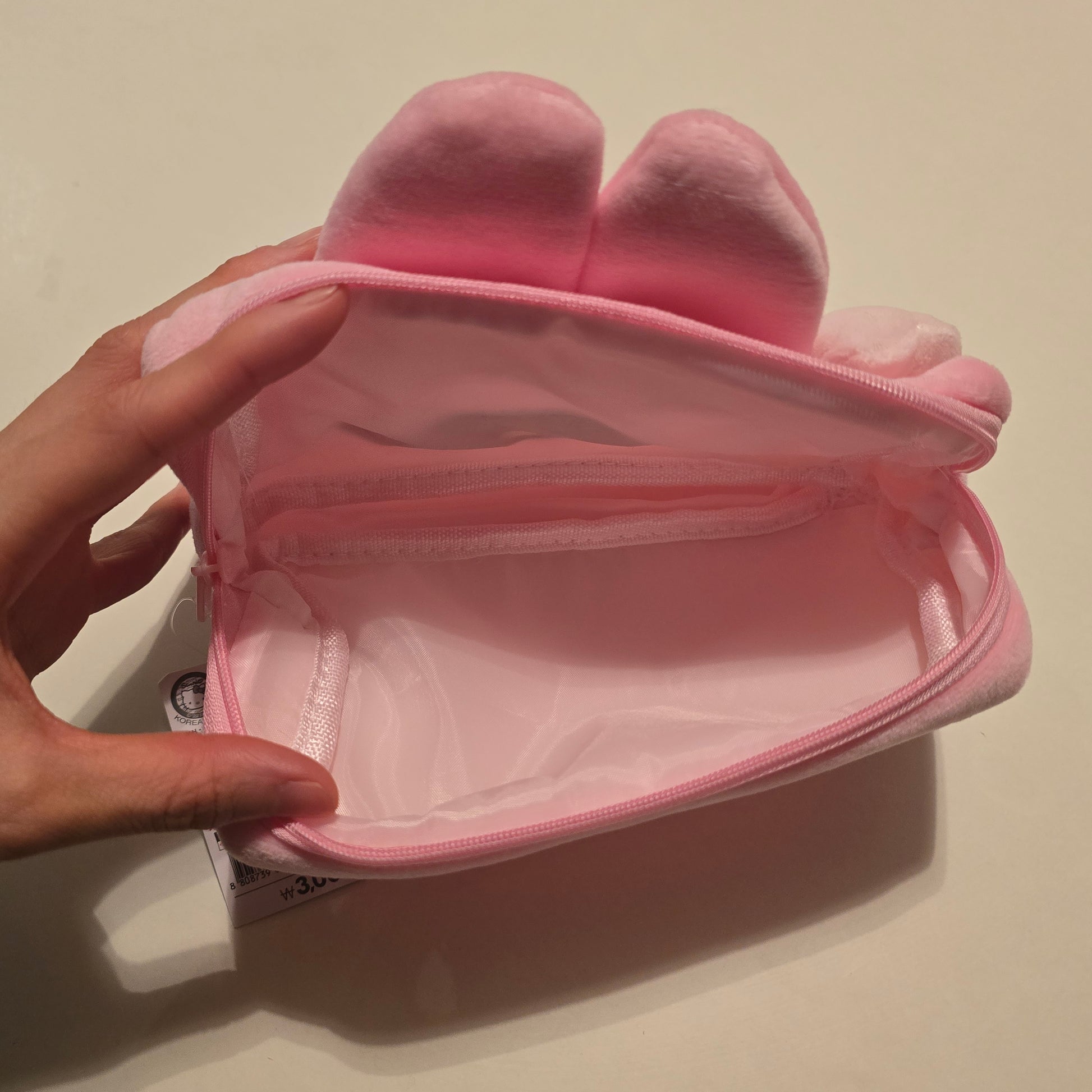 Daiso Korea Sanrio My Melody pouch interior view with spacious pink lining, ideal for organizing cosmetics in Sanrio pouch bag