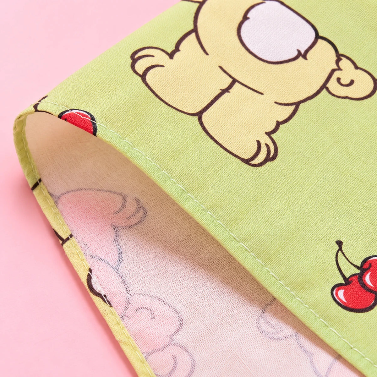 Flat lay of blue and green Witty Bunny cotton handkerchiefs with cherry details, cute bunny handkerchief